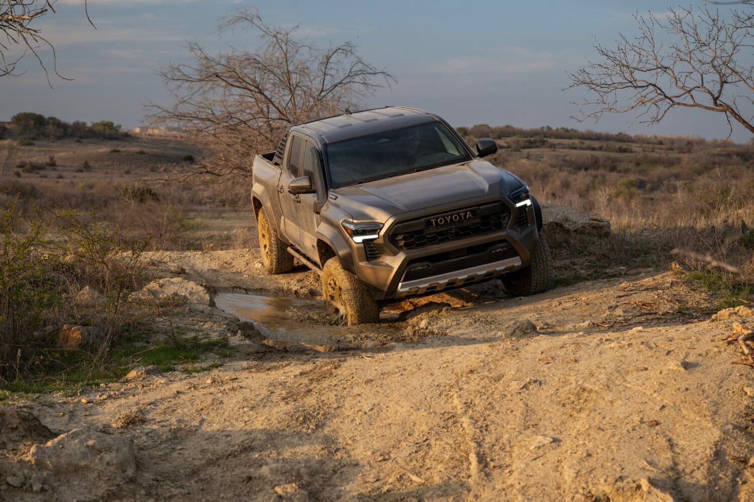 Toyota Tacoma Trailhunter driving offroad in mud